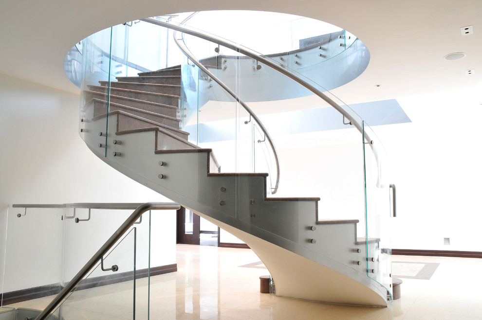 Example of a trendy curved staircase design in London