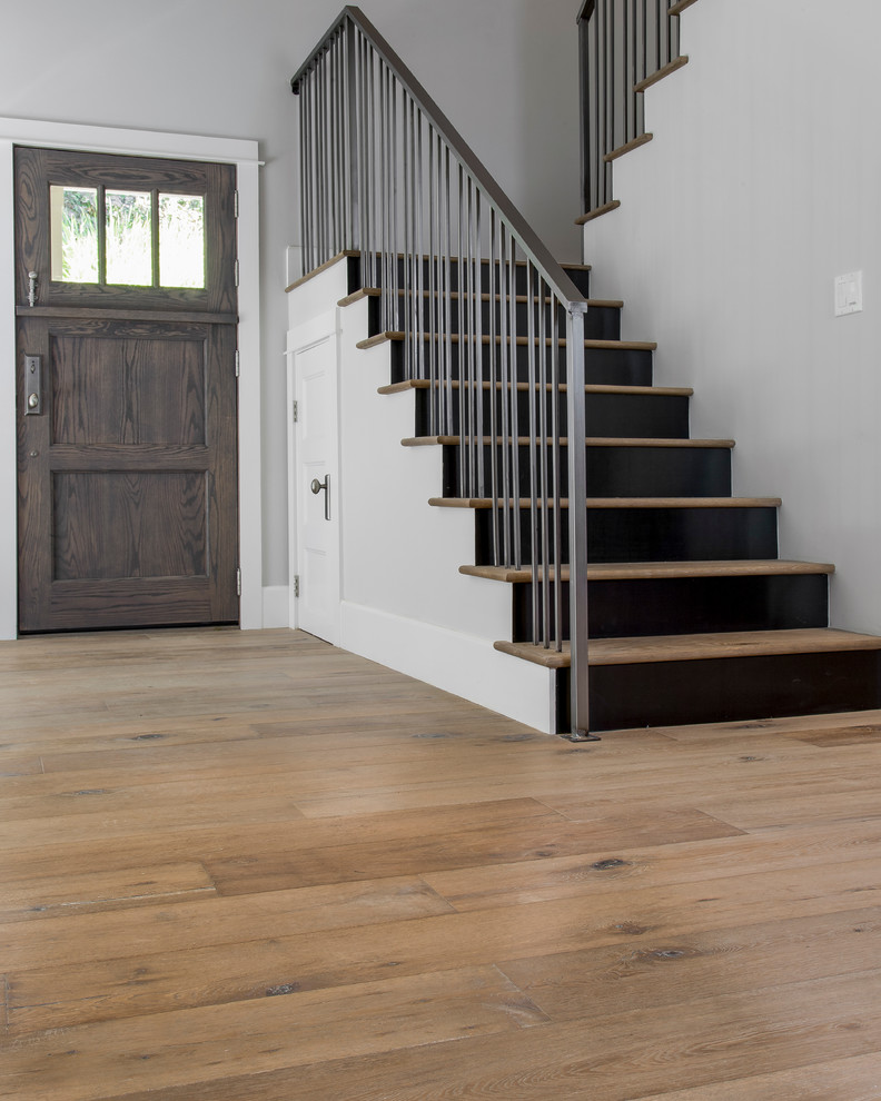 This is an example of a medium sized traditional wood l-shaped staircase in Los Angeles with painted wood risers.