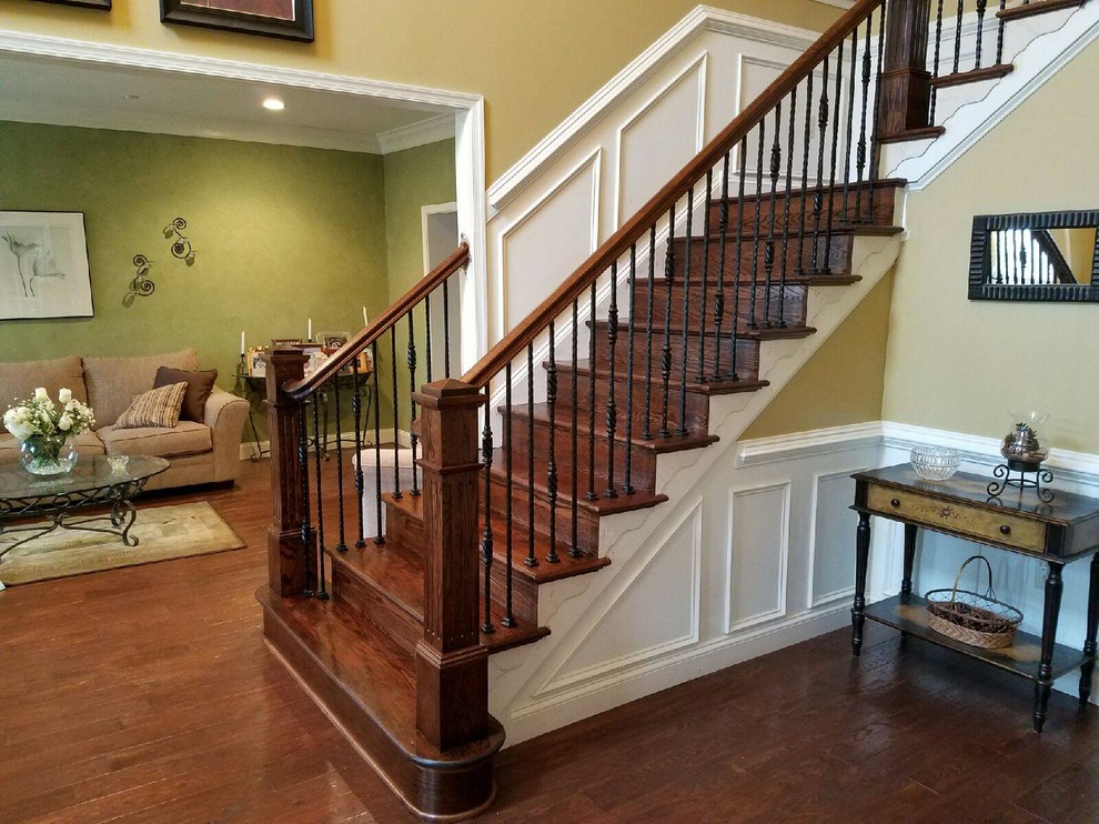 Large classic wood straight staircase in Philadelphia with wood risers.