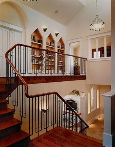 Large elegant wooden u-shaped wood railing staircase photo in San Francisco with wooden risers