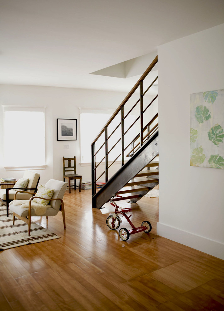 This is an example of a contemporary wood straight staircase in San Francisco with open risers.