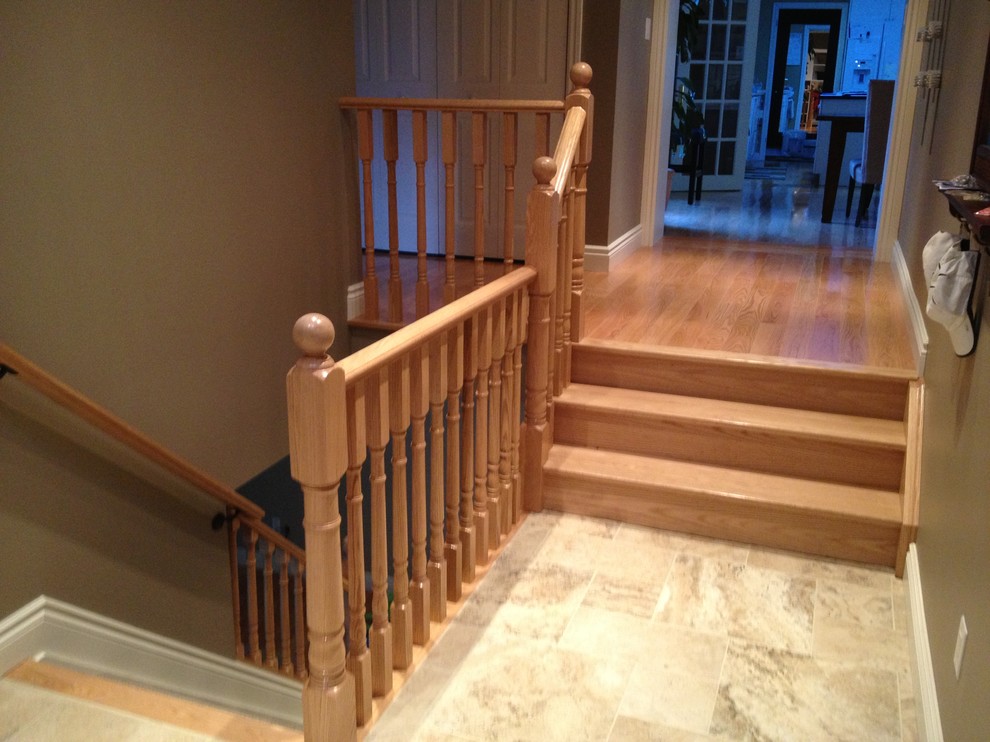 Example of a mid-sized classic carpeted straight staircase design in Toronto with carpeted risers