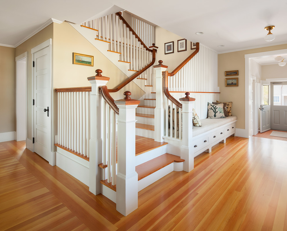 Inspiration for a beach style wood staircase in Portland Maine with feature lighting.