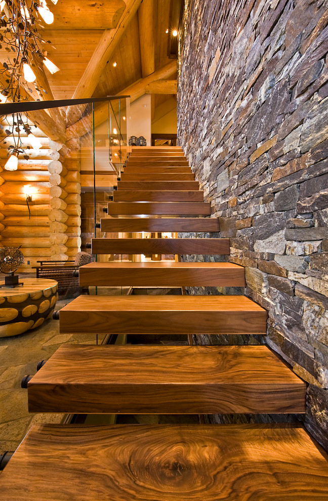 Inspiration for a rustic floating staircase remodel in Calgary
