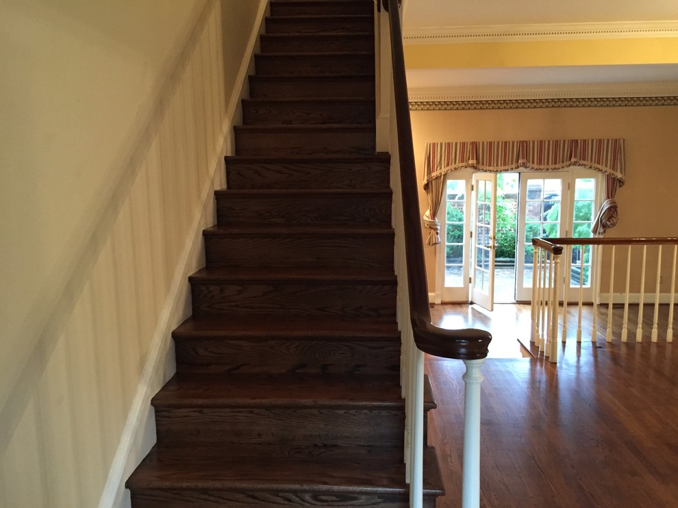 Inspiration for a large traditional wood straight wood railing staircase in DC Metro with wood risers.