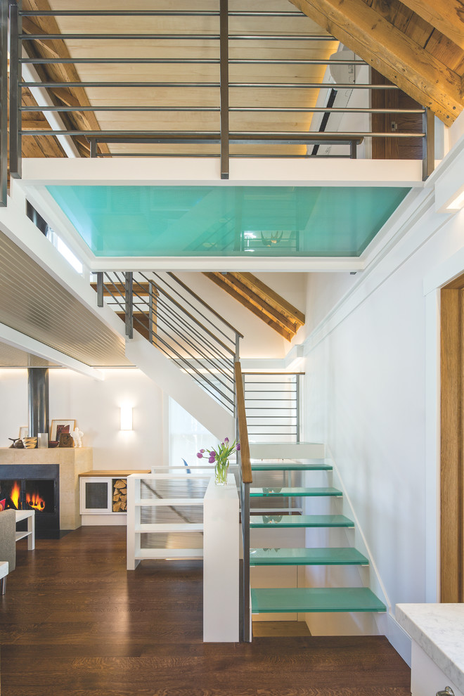 Inspiration for a large contemporary glass l-shaped metal railing staircase in Salt Lake City with open risers.