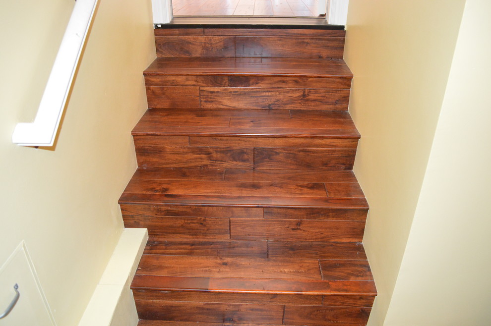 Design ideas for a traditional wood staircase in San Francisco with wood risers.