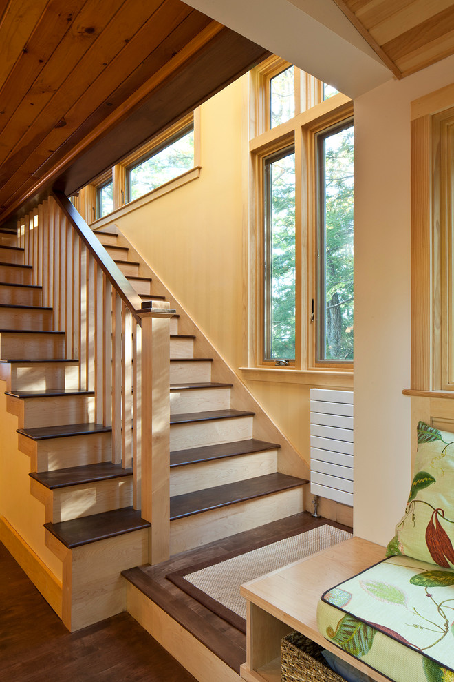 Inspiration for a modern wood straight staircase in Portland Maine with wood risers.