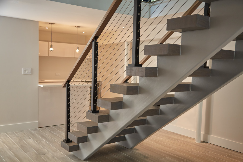Design ideas for a large modern wood floating wood railing staircase in Other.