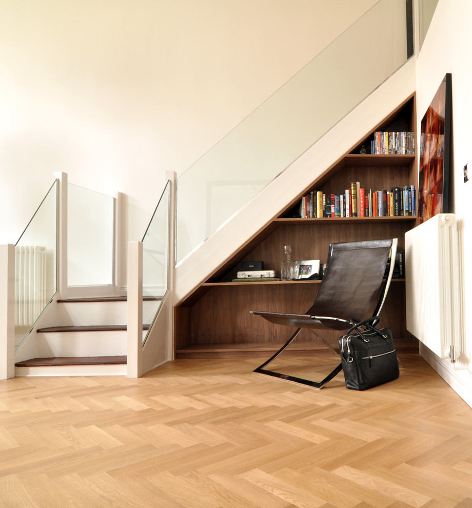 Photo of a contemporary staircase in London with under stair storage.