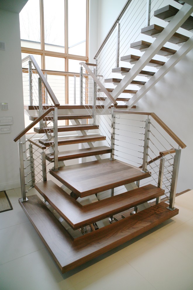 Example of a mid-sized minimalist wooden floating open staircase design in DC Metro