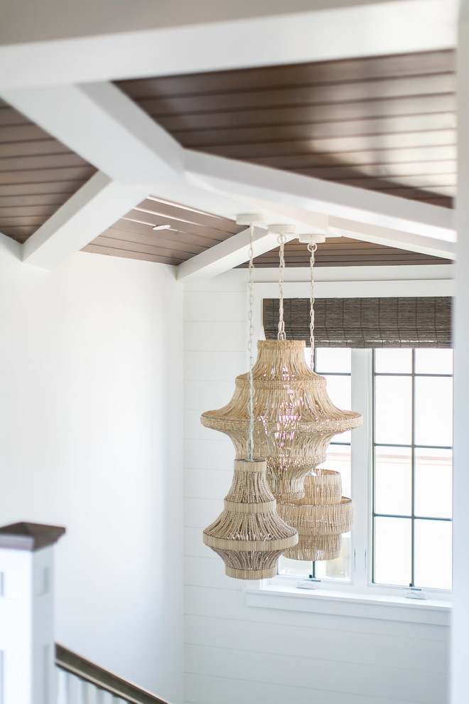 Staircase - large tropical wooden u-shaped wood railing staircase idea in Orange County