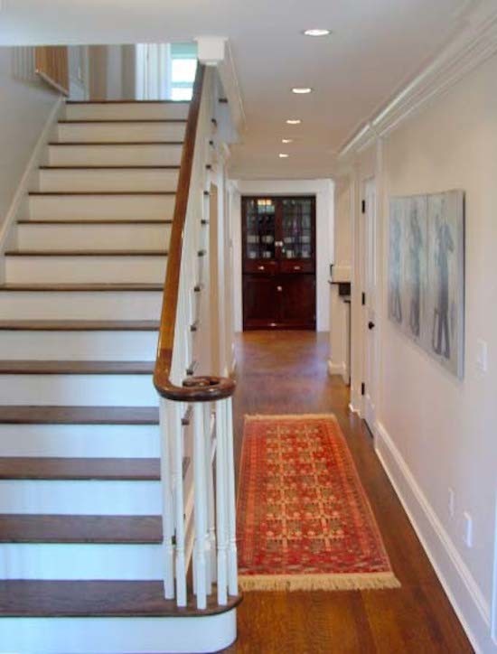 This is an example of a classic wood straight staircase in New York with painted wood risers.