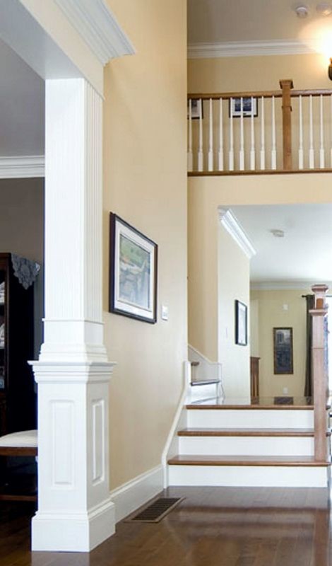 Mid-sized elegant wooden l-shaped wood railing staircase photo in Other with painted risers