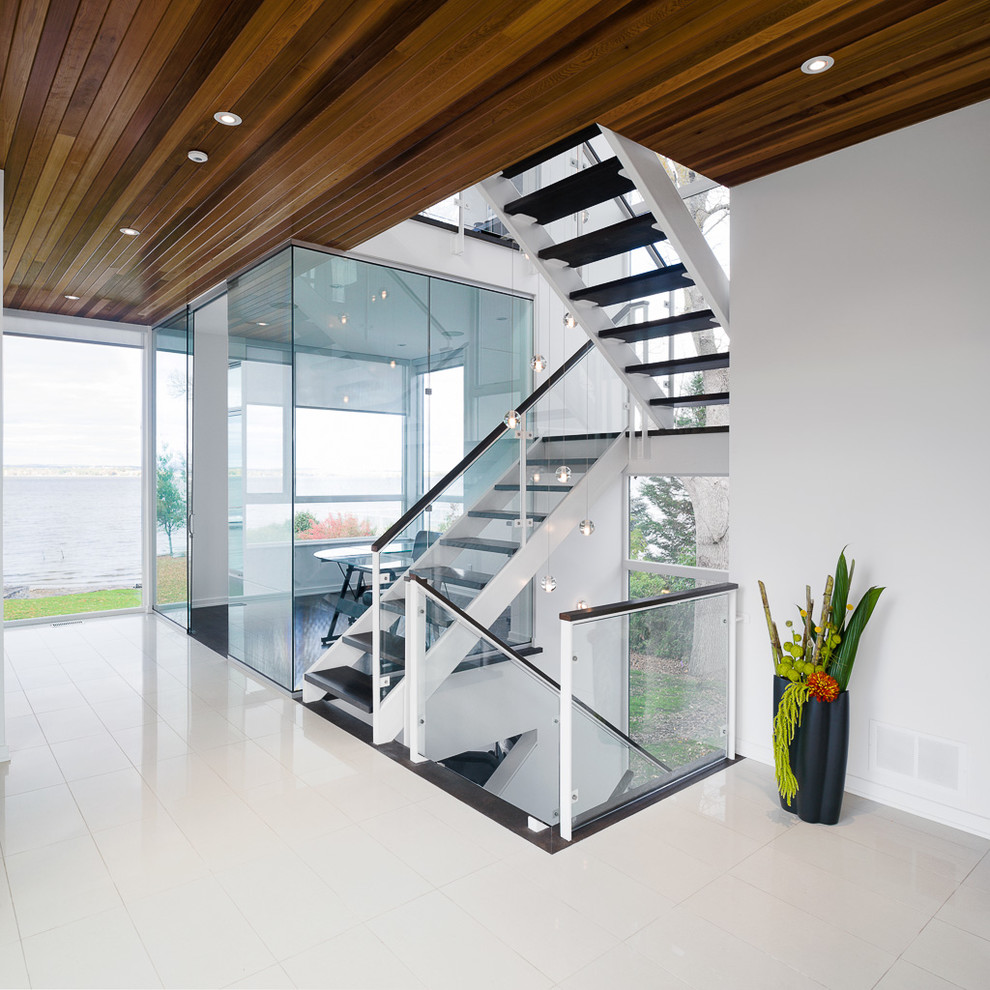 Example of a trendy wooden u-shaped open staircase design in Ottawa