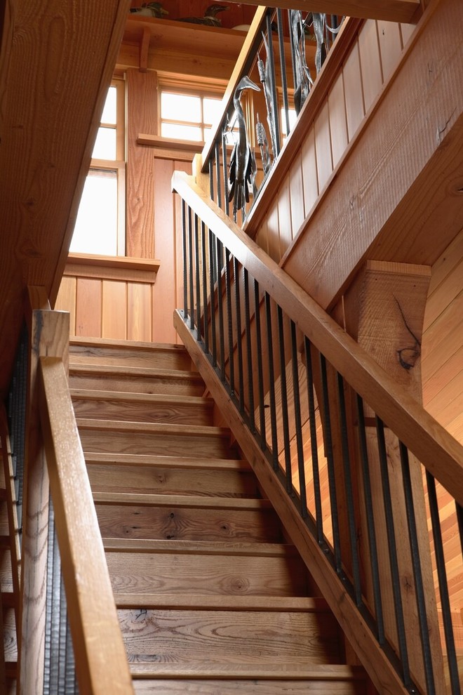 Staircase - rustic wooden mixed material railing staircase idea in Minneapolis with wooden risers