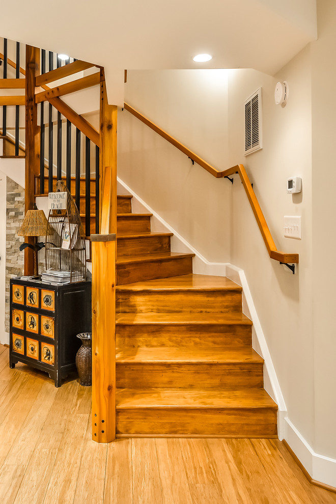 Design ideas for a large coastal wood spiral staircase in DC Metro with wood risers.