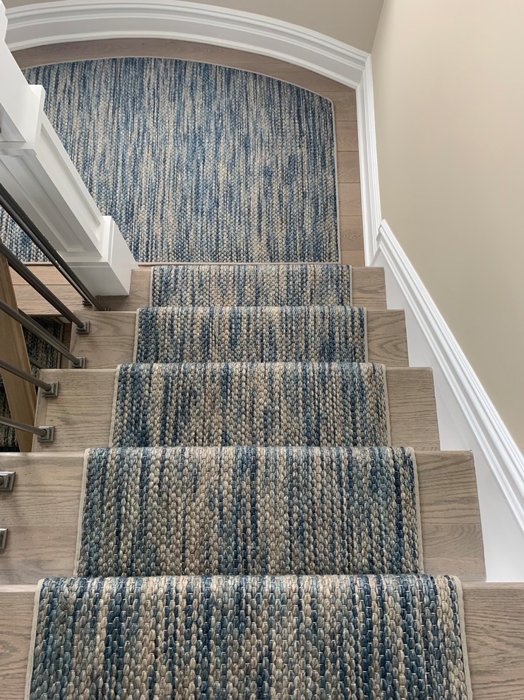 Inspiration for a mid-sized transitional carpeted l-shaped wood railing staircase remodel in Philadelphia with carpeted risers
