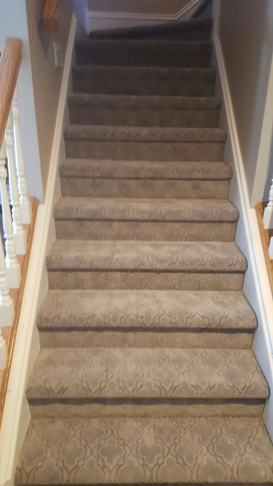 Example of a large classic carpeted l-shaped wood railing staircase design in Indianapolis with wooden risers