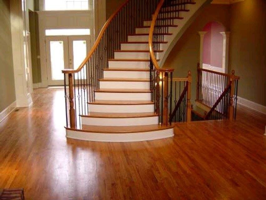 Staircase - huge traditional wooden curved mixed material railing staircase idea in Cleveland with painted risers