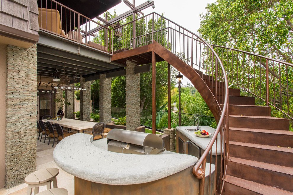 Staircase - large mediterranean metal curved staircase idea in Los Angeles with metal risers