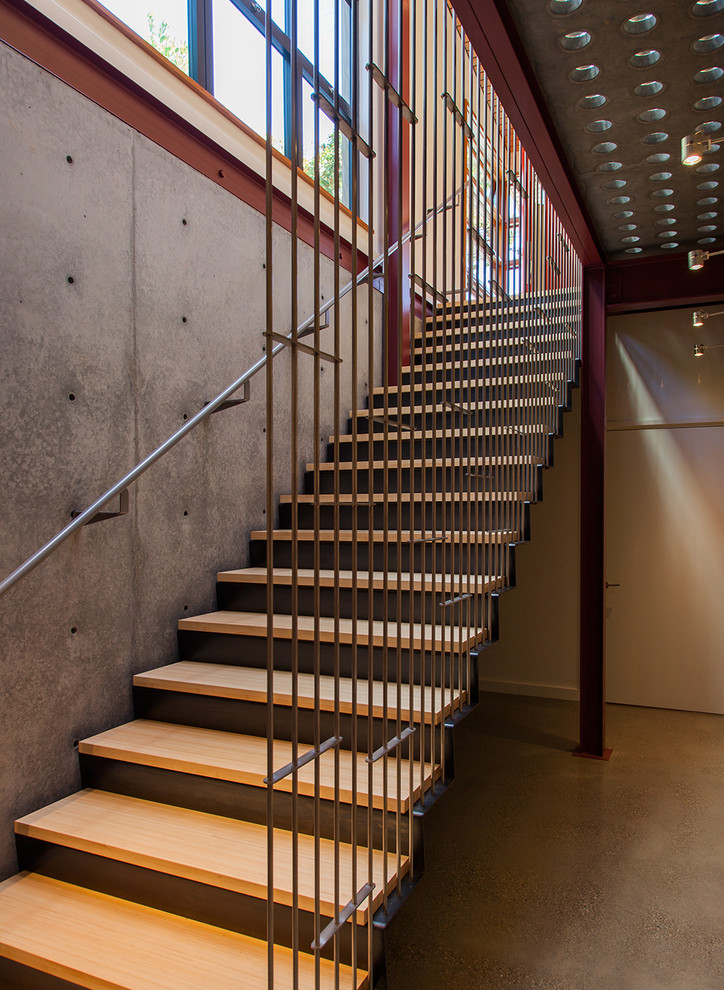 Photo of a contemporary straight staircase in San Francisco with open risers.
