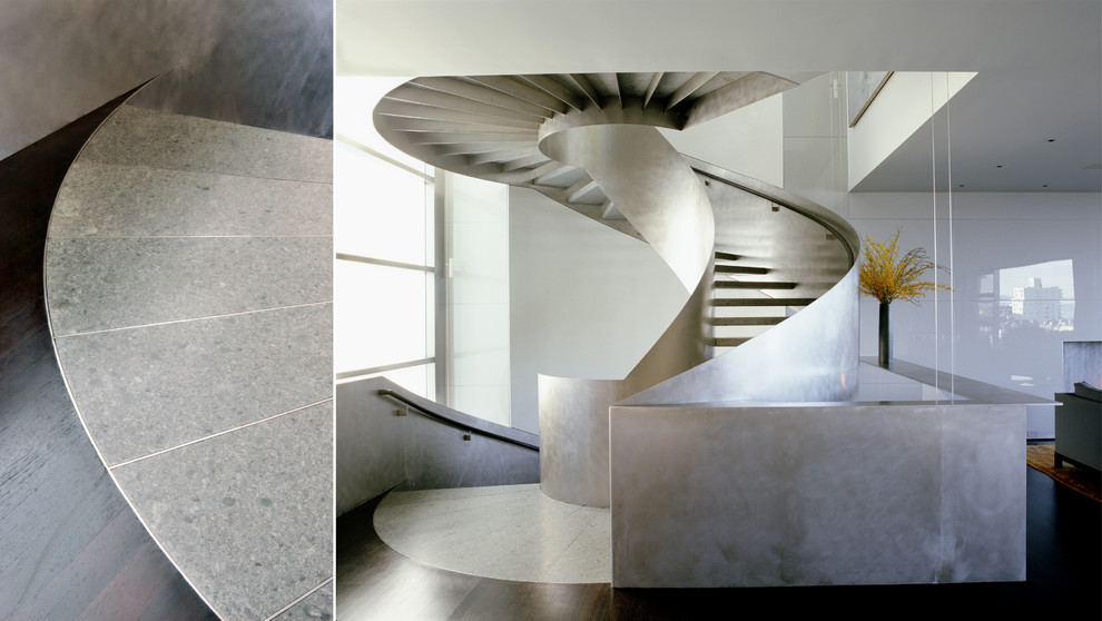 This is an example of a contemporary curved staircase in San Francisco with open risers.