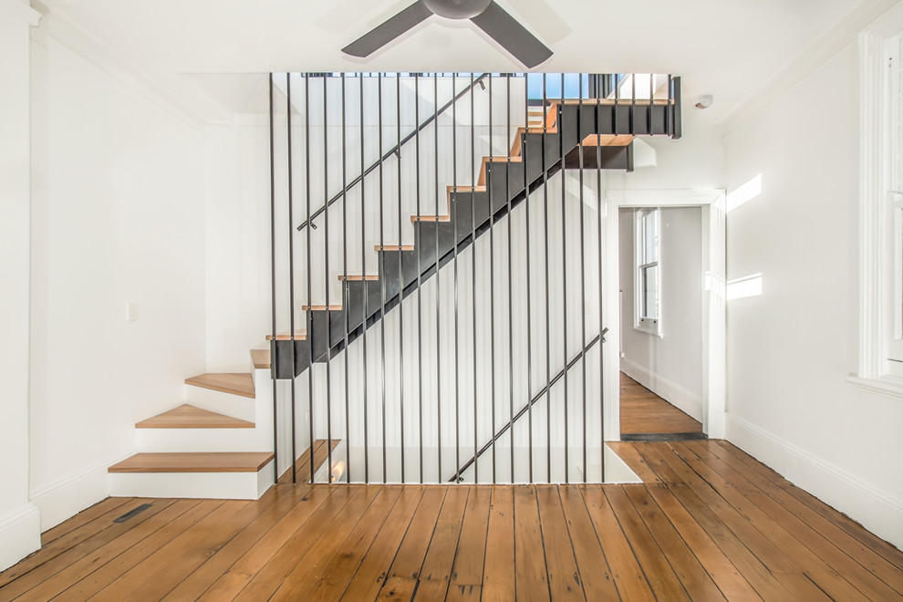 Inspiration for a mid-sized modern wooden floating open and metal railing staircase remodel in Sydney