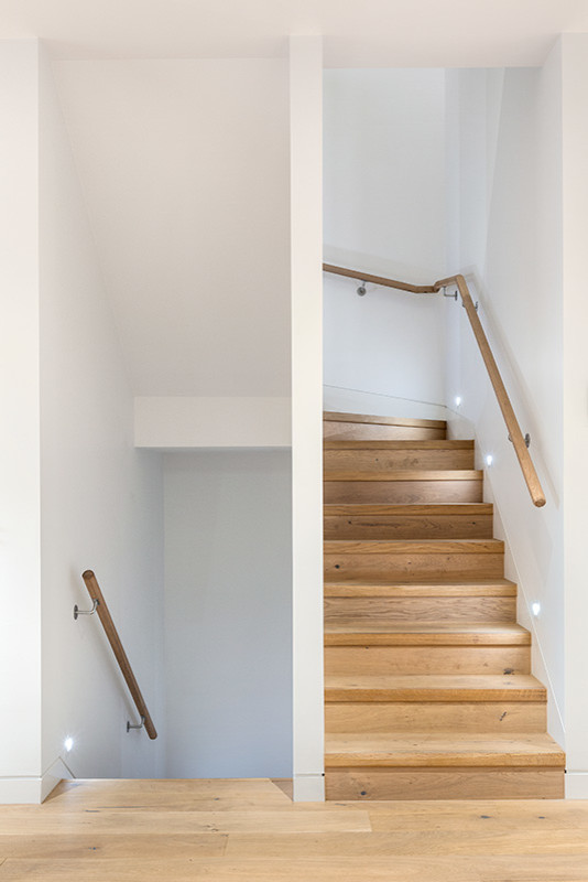 Staircase - contemporary wooden u-shaped staircase idea in Melbourne with wooden risers