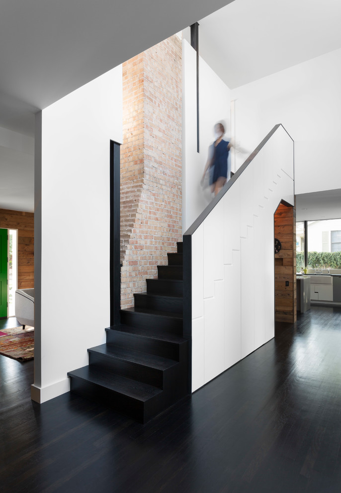 This is an example of a contemporary straight staircase in Austin.