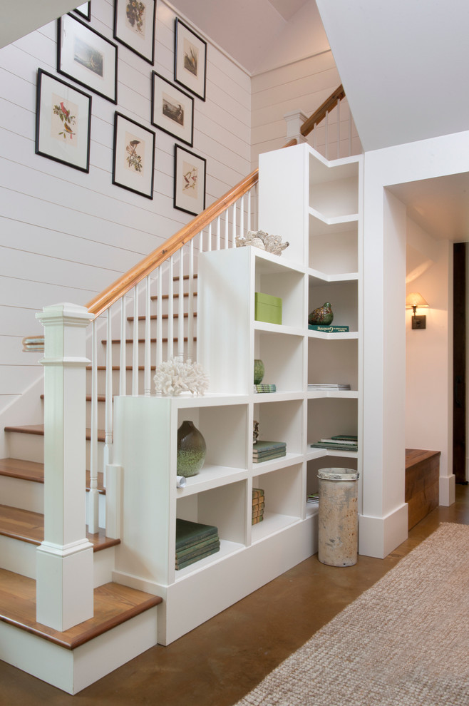 Beach style wooden u-shaped staircase photo in Atlanta with painted risers