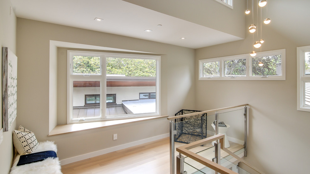 Inspiration for a contemporary u-shaped glass railing staircase remodel in San Francisco