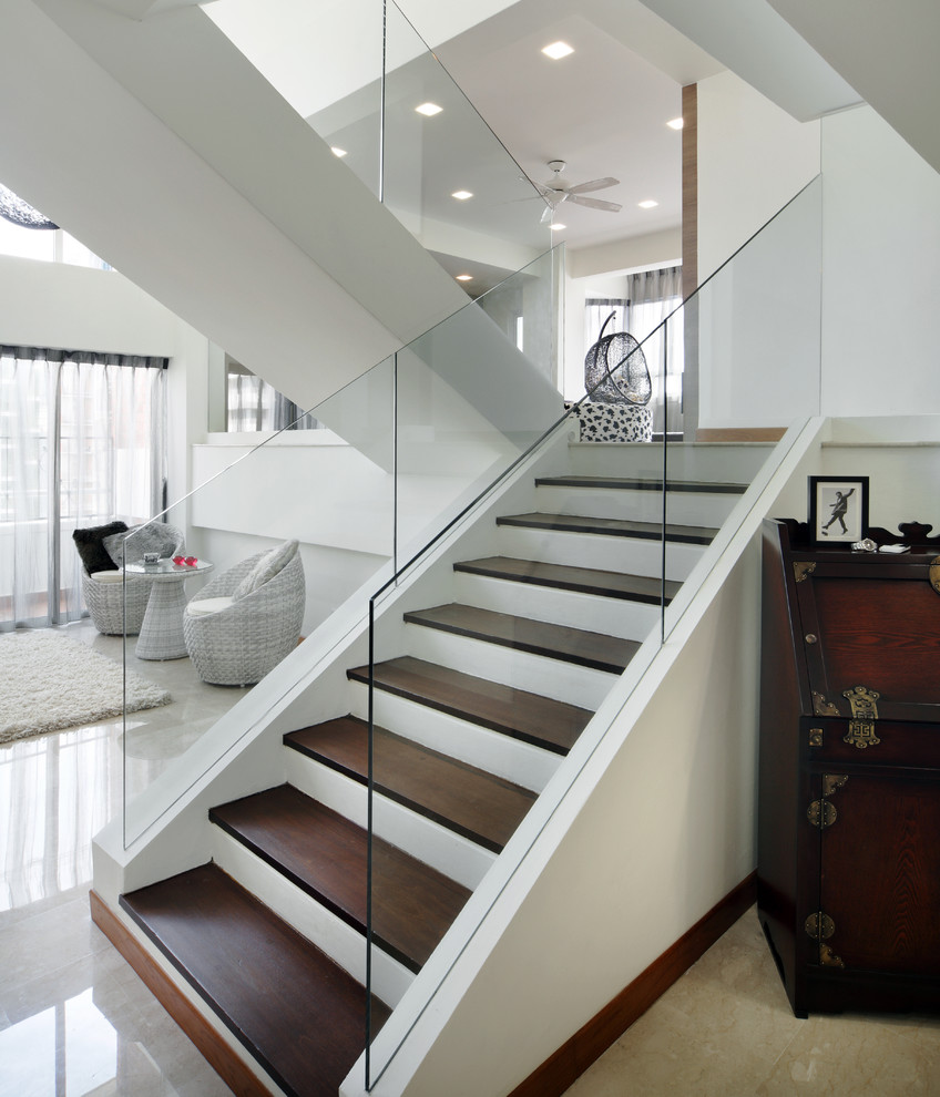 Inspiration for a modern staircase in Singapore with painted wood risers.