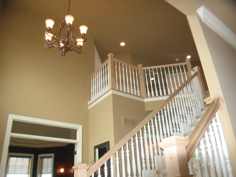 Photo of a medium sized traditional carpeted straight staircase in Other with carpeted risers.
