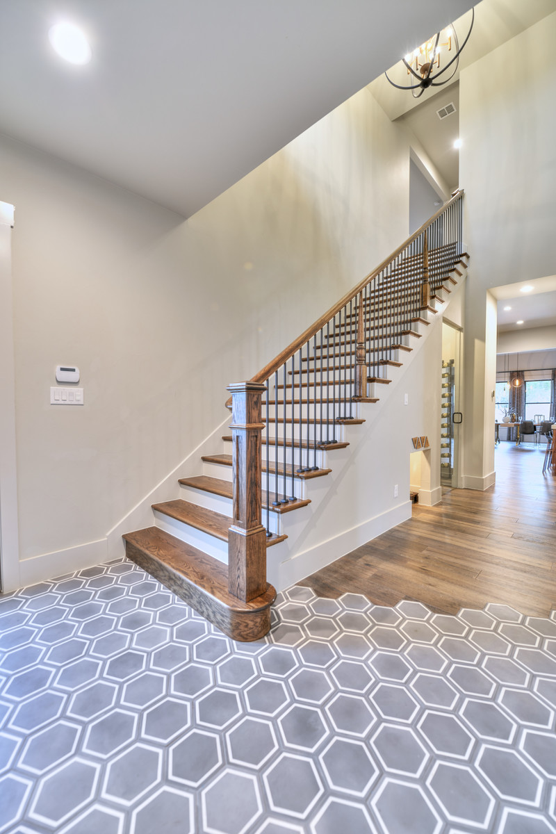 Mid-sized transitional wooden straight metal railing staircase photo in Austin with painted risers