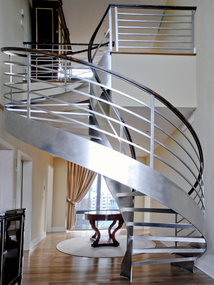 Example of a trendy wooden spiral open staircase design in New York