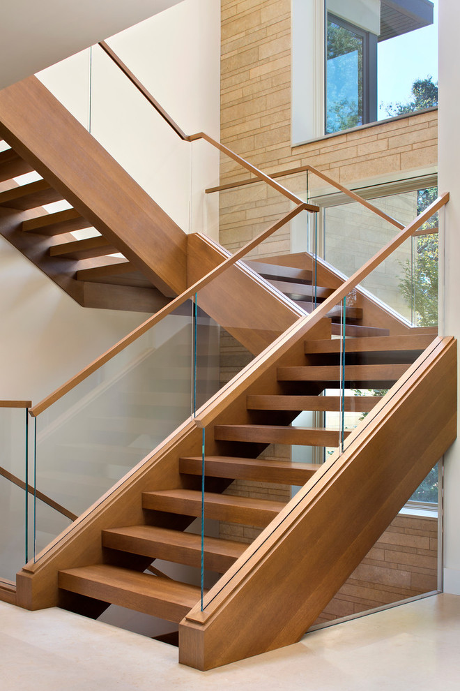 Large minimalist wooden floating staircase photo in San Francisco with wooden risers