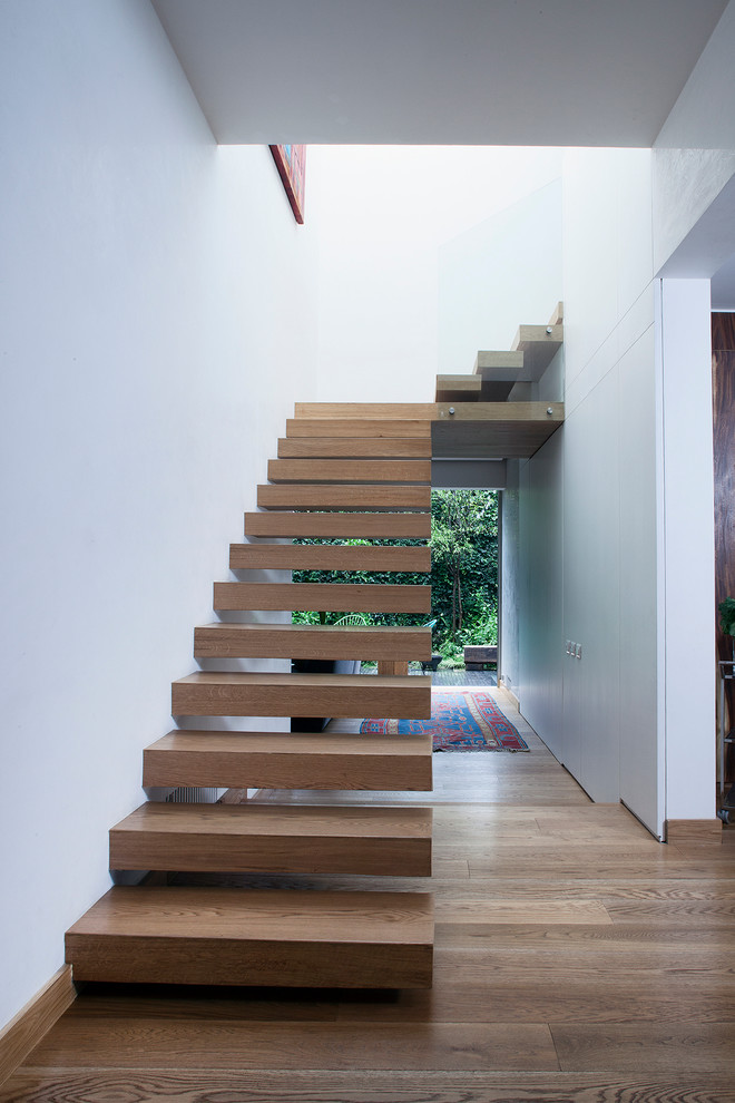 Inspiration for a contemporary floating staircase in Mexico City with open risers.