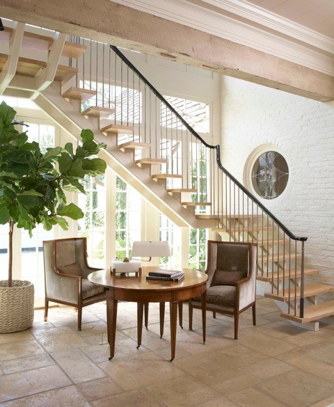 Inspiration pour un escalier sans contremarche traditionnel en L de taille moyenne avec des marches en bois.