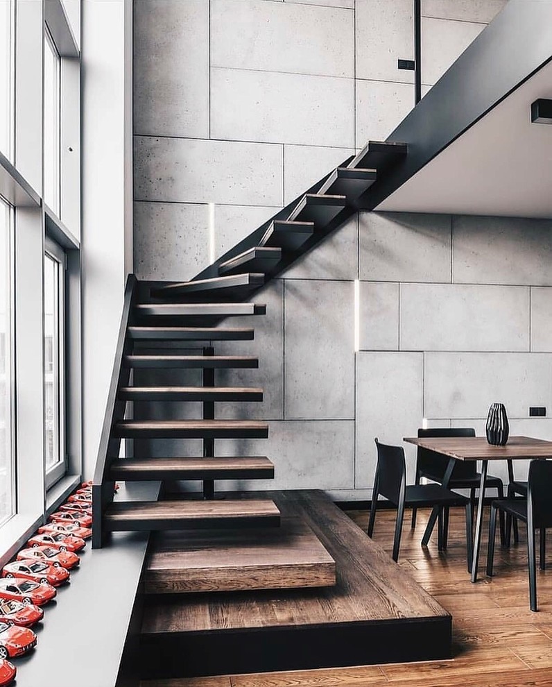 Inspiration for a contemporary wood l-shaped staircase in Other with open risers.