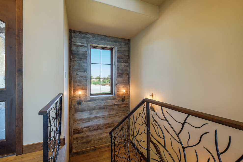 Inspiration for a medium sized rustic wood u-shaped staircase in Denver with wood risers.
