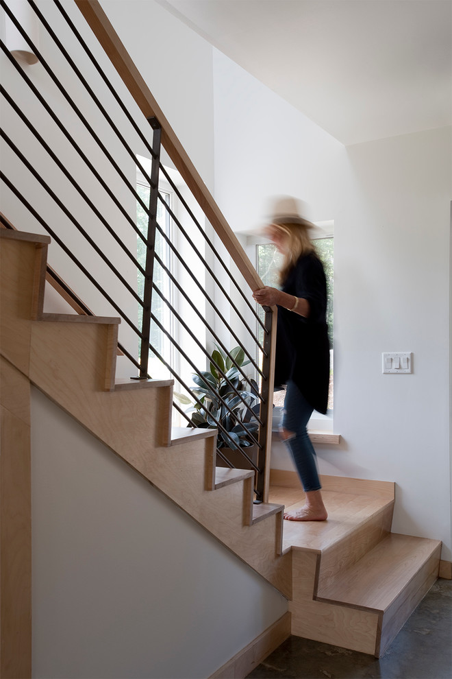 Idées déco pour un escalier contemporain en L avec des marches en bois et des contremarches en bois.