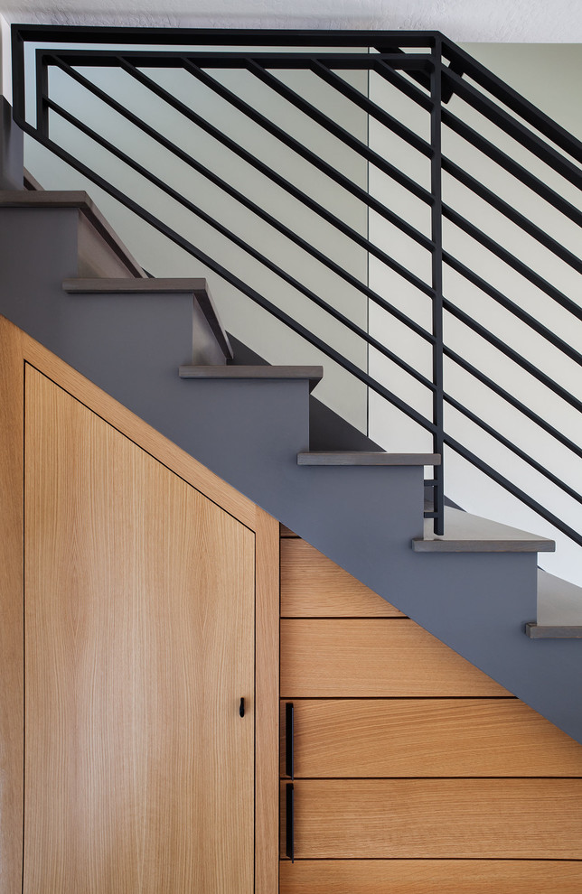 Large minimalist concrete straight staircase photo in San Francisco with concrete risers