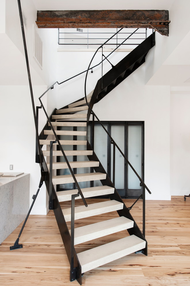 This is an example of an industrial staircase in New York with feature lighting.