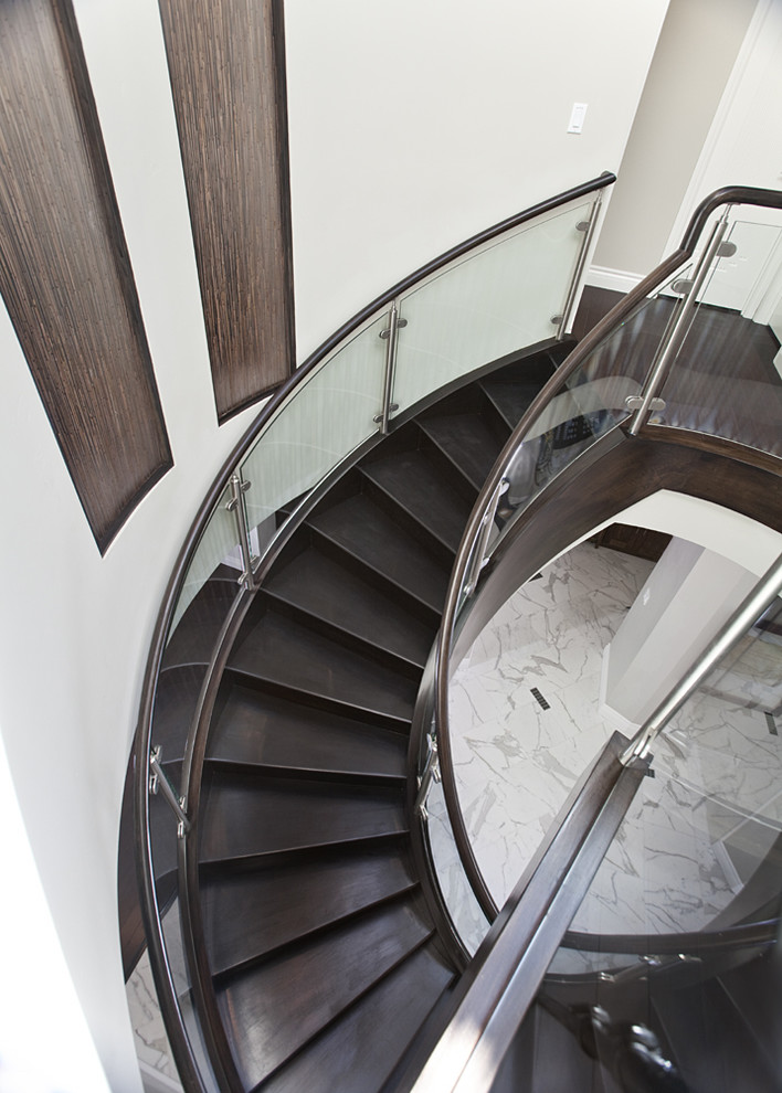 Staircase - modern wooden curved staircase idea in San Francisco