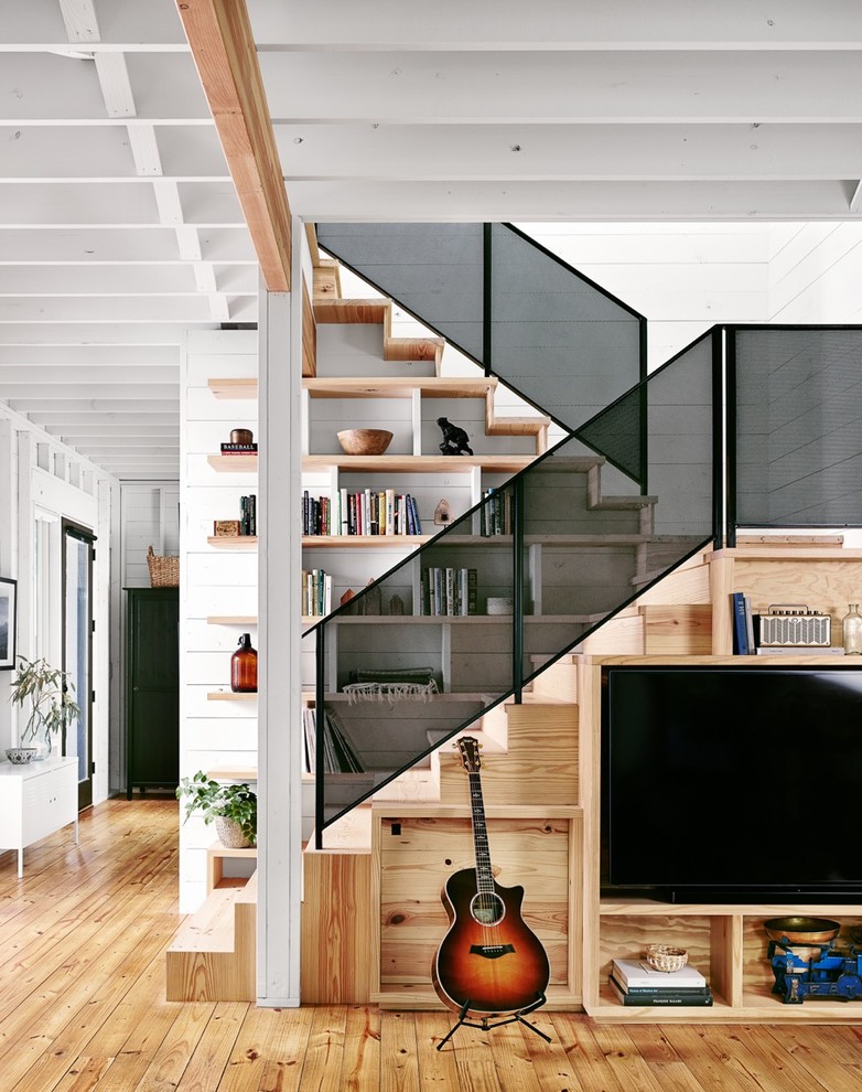 Inspiration for a mid-sized cottage wooden u-shaped staircase remodel in Austin with wooden risers