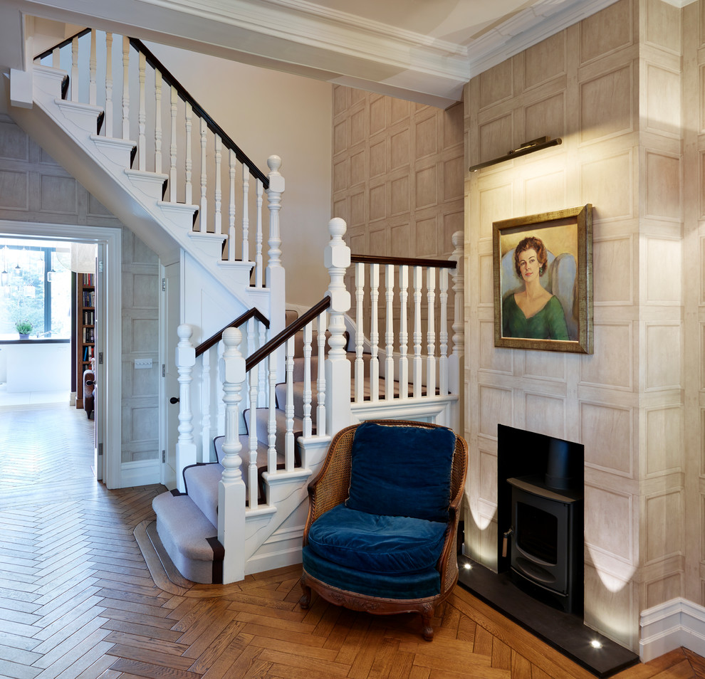 Inspiration for a classic carpeted u-shaped staircase in London with carpeted risers.