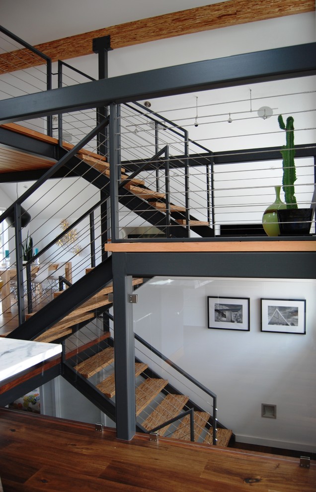 Trendy open and cable railing staircase photo in Seattle