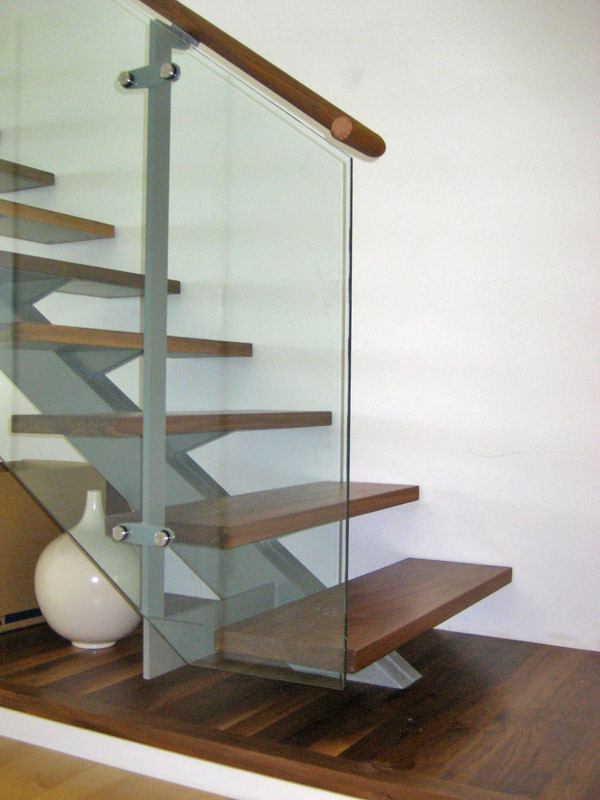Inspiration for a large modern wooden straight open staircase remodel in Sacramento