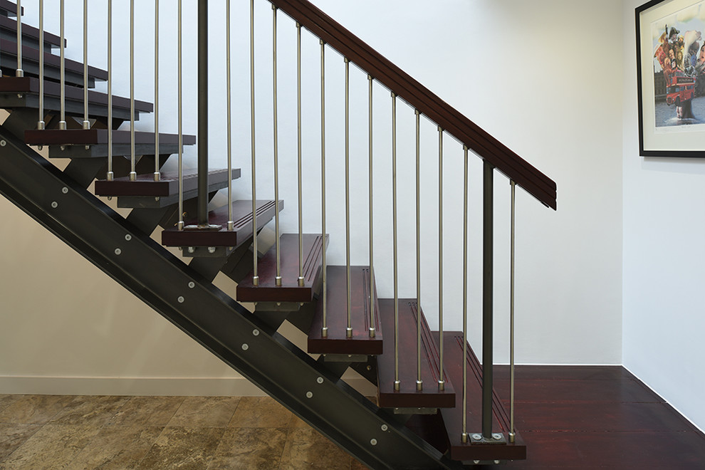 Photo of a medium sized urban wood straight staircase in London with open risers.